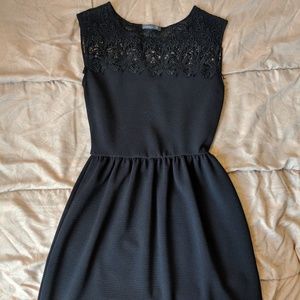 Black cocktail dress with lace neckline